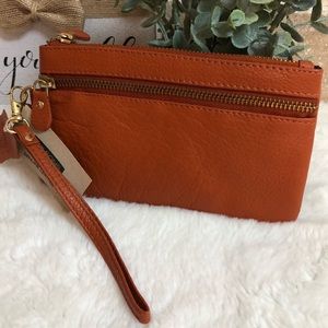 Burnt Orange Colored wristlet by Wilson’s Leather